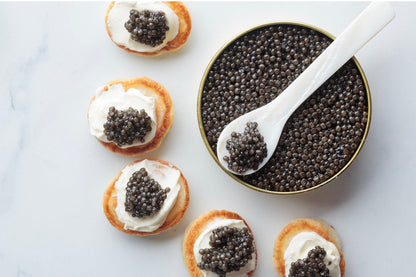 500g Caviar, 64 Blinis, 500g Creme Fraiche & x4 Mother of Pearl Spoons