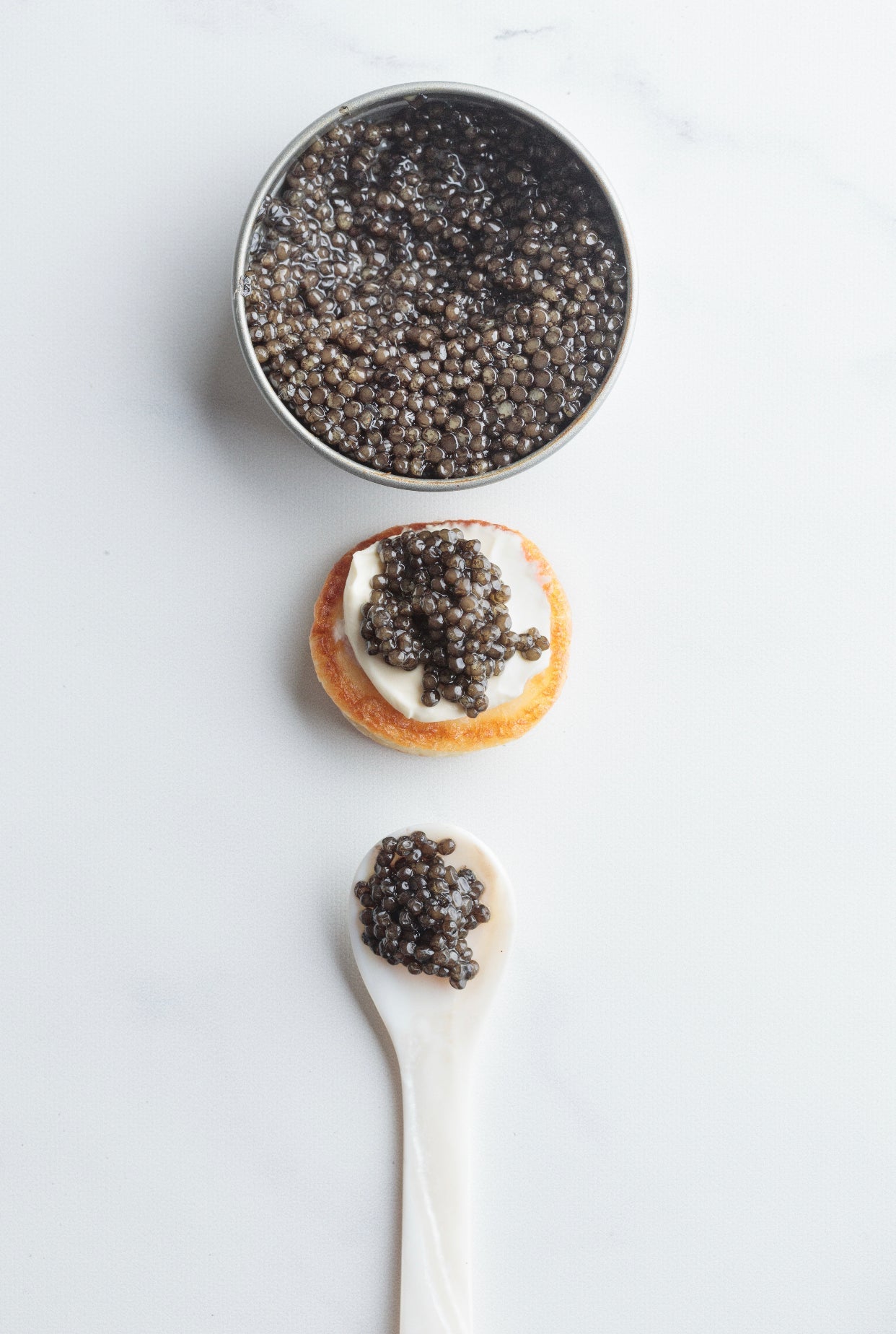 500g Caviar, 64 Blinis, 500g Creme Fraiche & x4 Mother of Pearl Spoons